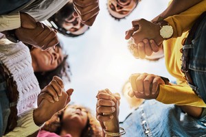 Cropped shot of a group of friends holding hands for better sexual and reproductive rights